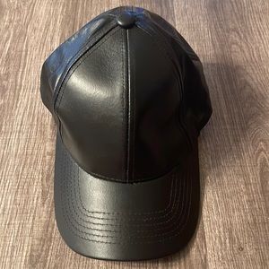 NWOT Black Leather Cap. City Hunter Brand name. Adjustable velcro in the back.